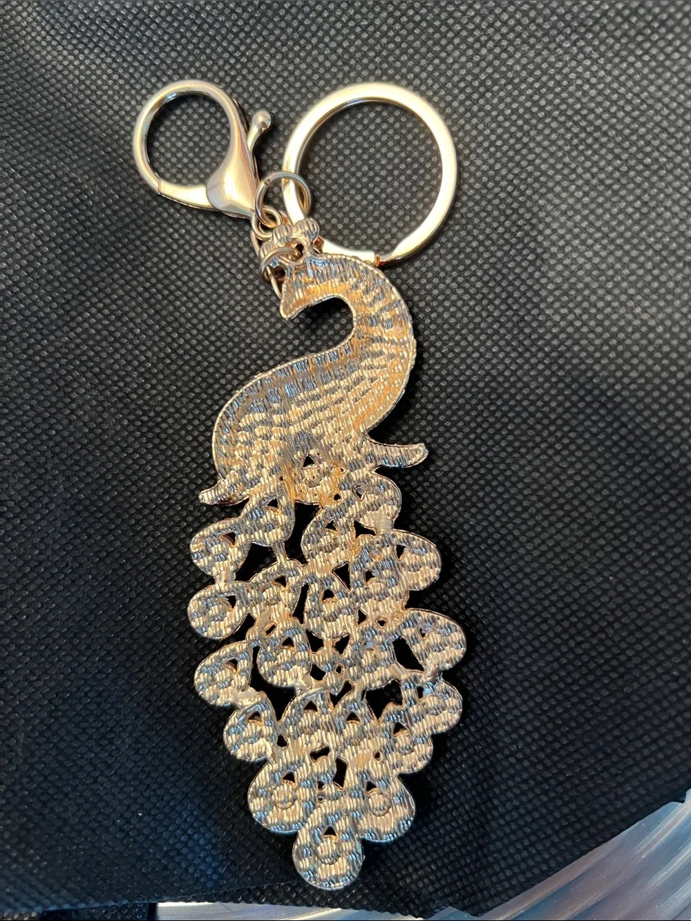 PEACOCK KEYCHAIN- Pink, Red and Iridescent stones set in Gold tone.